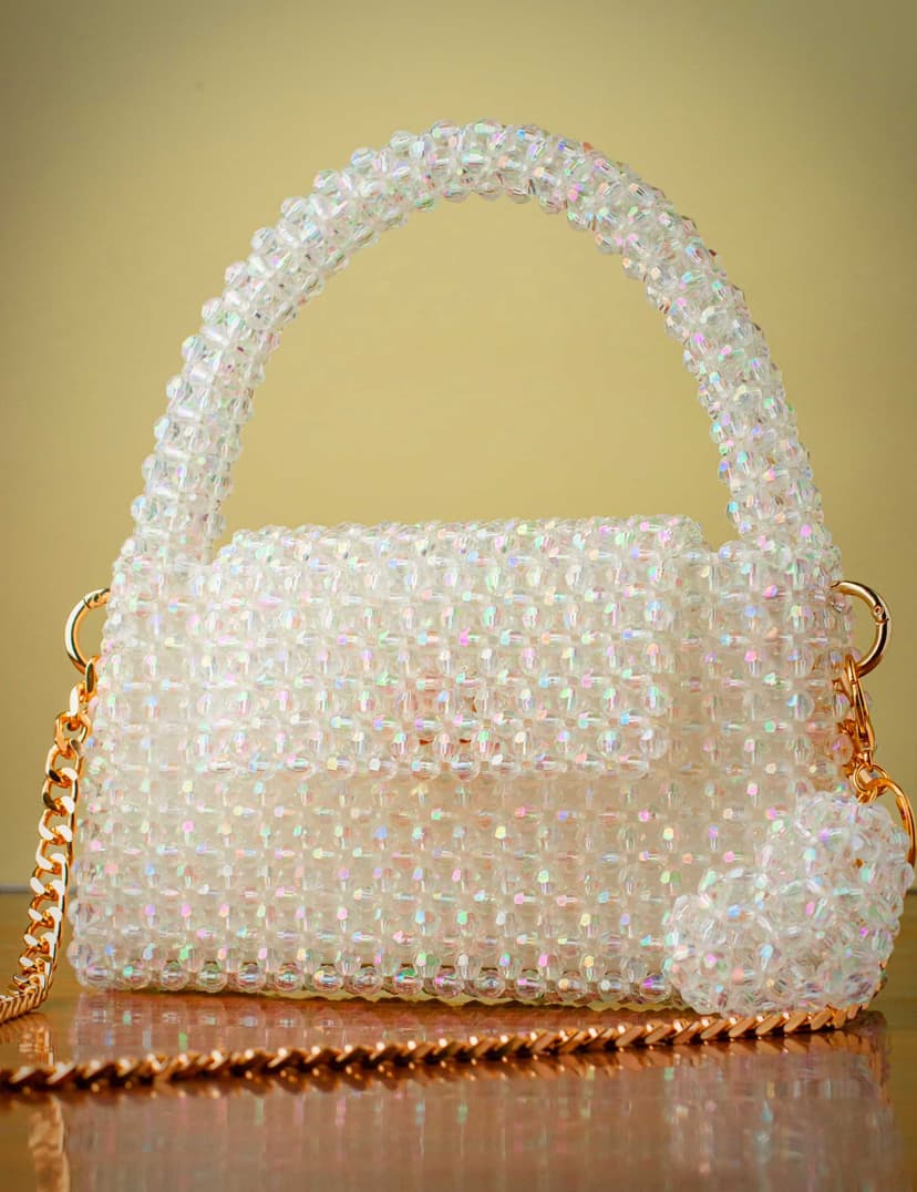 A luxurious, fully handcrafted handbag made from acrylic crystal off-white