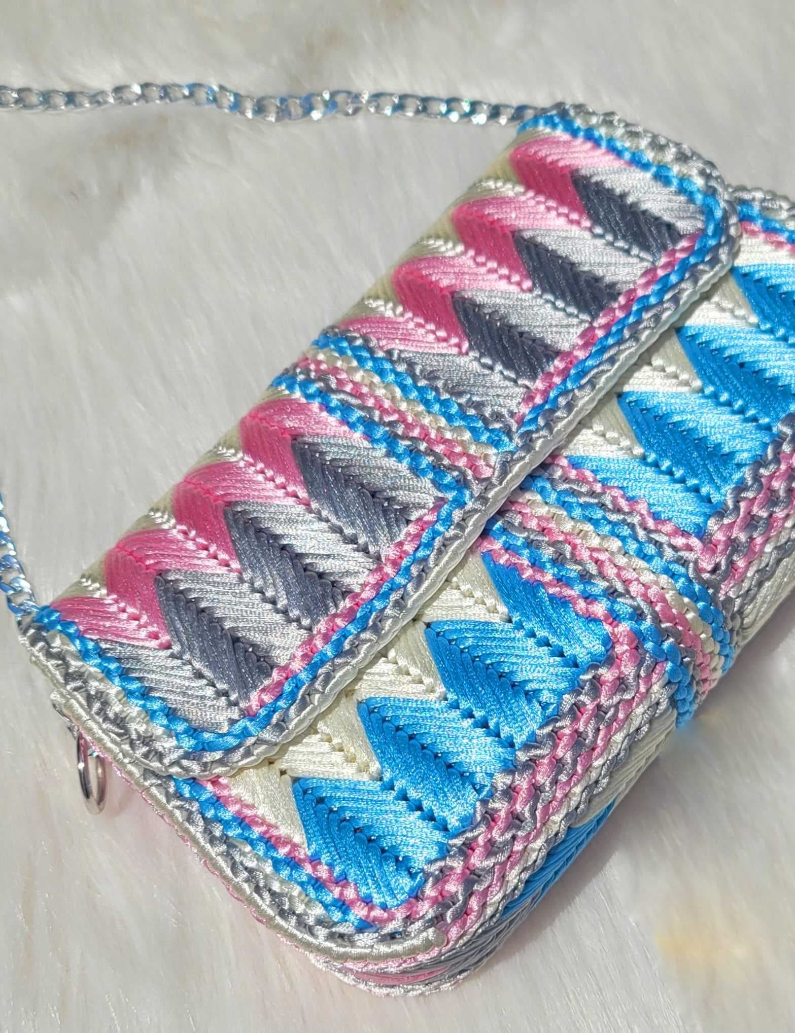 a stylish small bag made from colorful satin light Blue