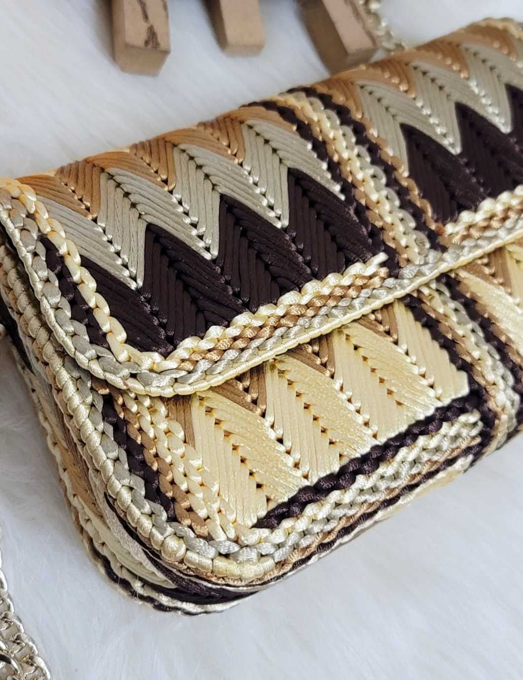 a stylish small bag made from colorful satin brown