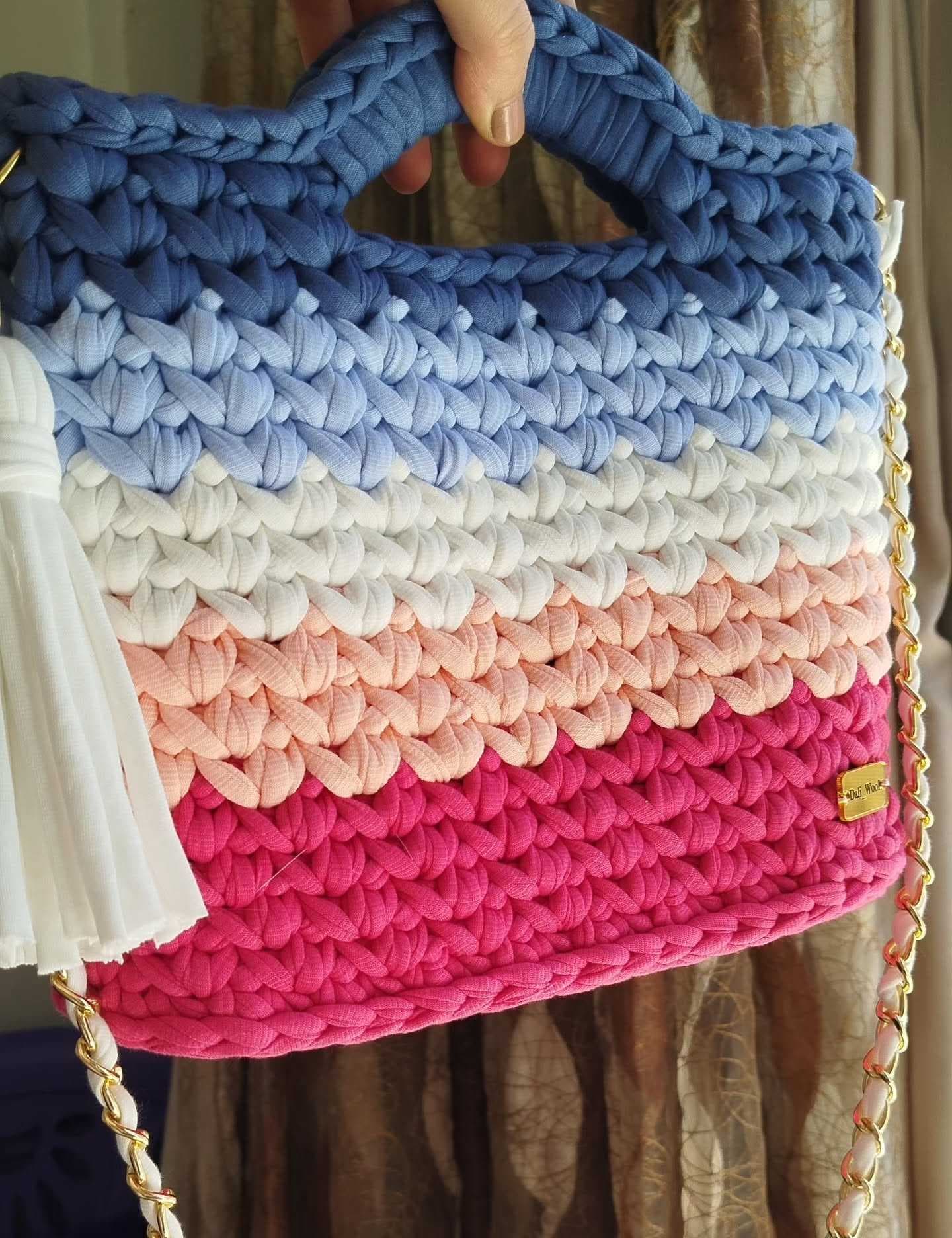 A stylish handcrafted crochet handbag pinkish